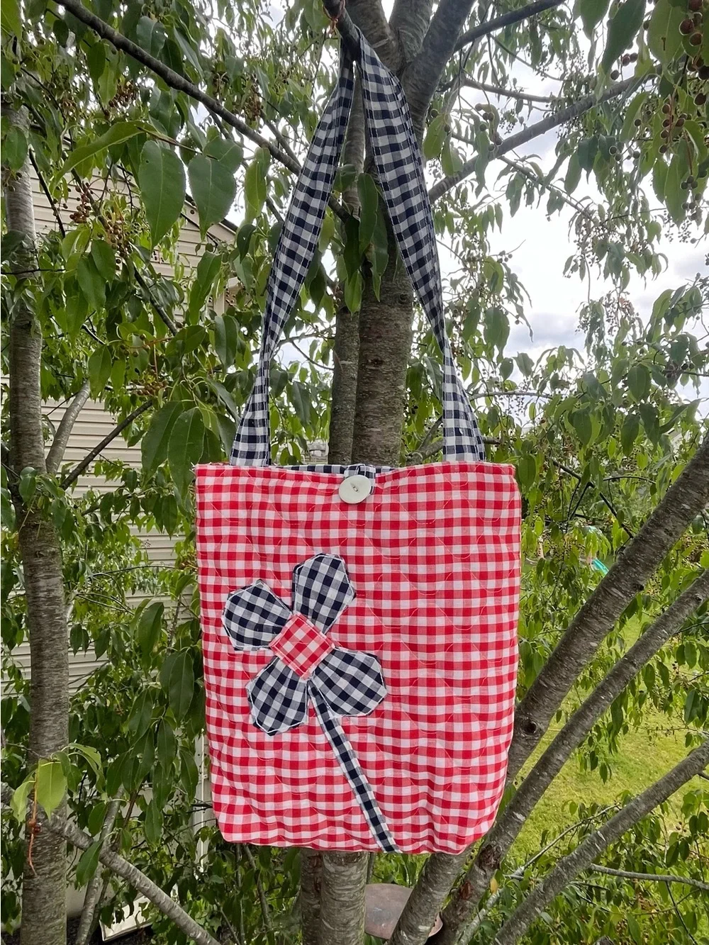 Quilted handmade tote bag red, navy blue and white gingham pattern, front flower